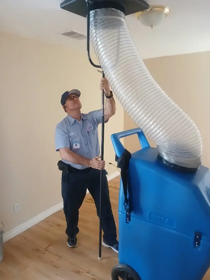 HVAC Installation technician using HEPA equipment in White